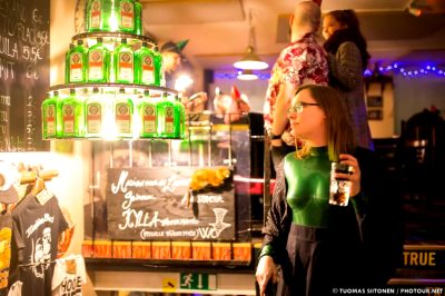 A Chandelier Made Out Of Jägermeister And A Green Catsuit In A Pub