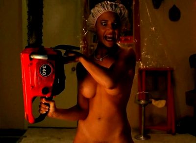 Scream queen Michelle Bauer naked chainsaw wielding for Halloween
